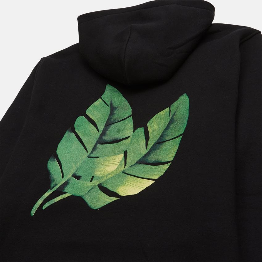 Detalje af grøn-blad printet på ryggen af Montana Hoodie Black